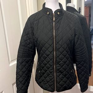 Black quilted jacket gently used
